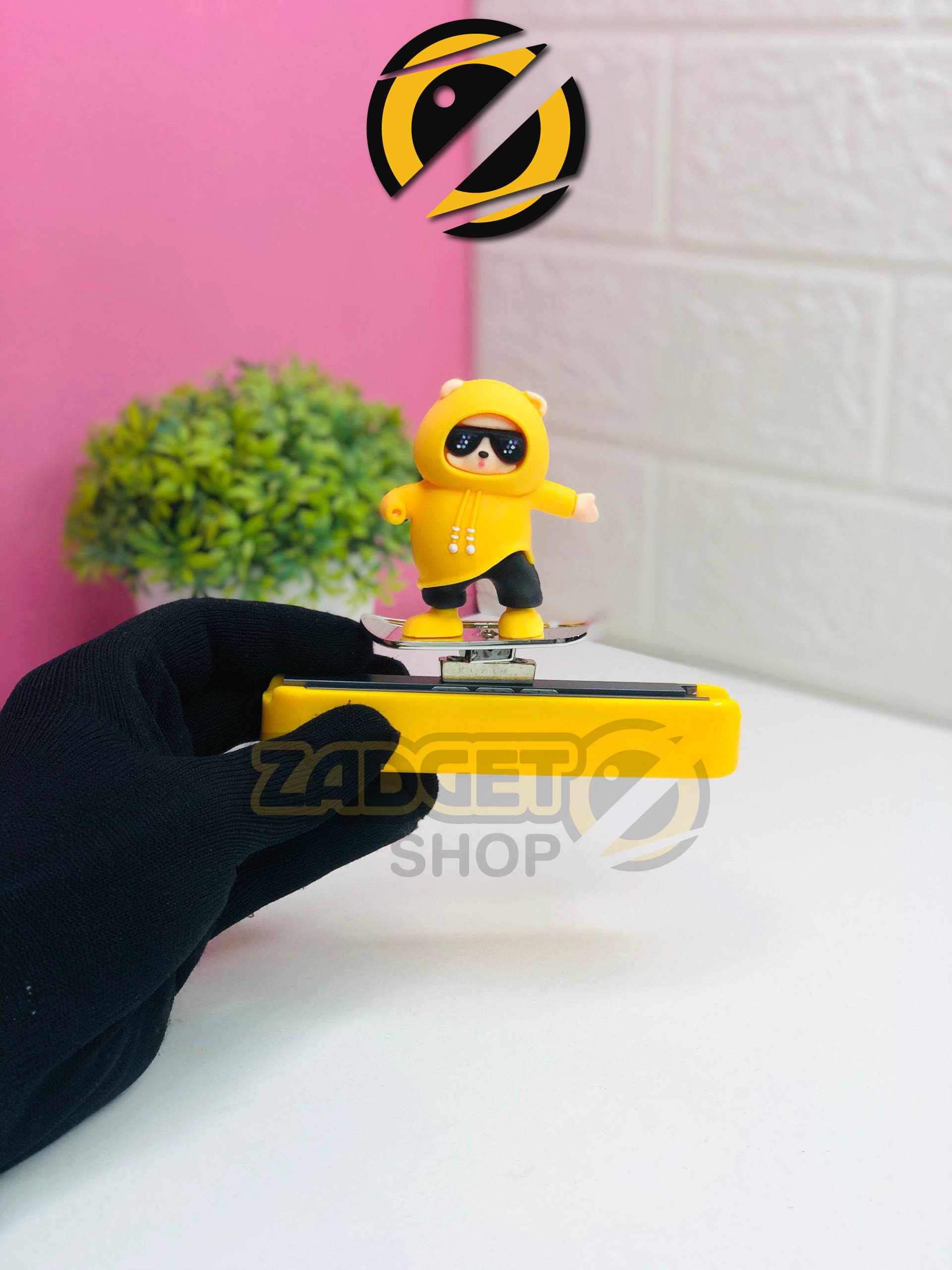 ZOUIVU X BEAR Car Dashboard Ornament C0665 handheld view with yellow hoodie bear and stylish car decoration base