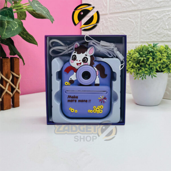Children’s Fun Instant Print Camera package contents with paper roll, charging cable and strap