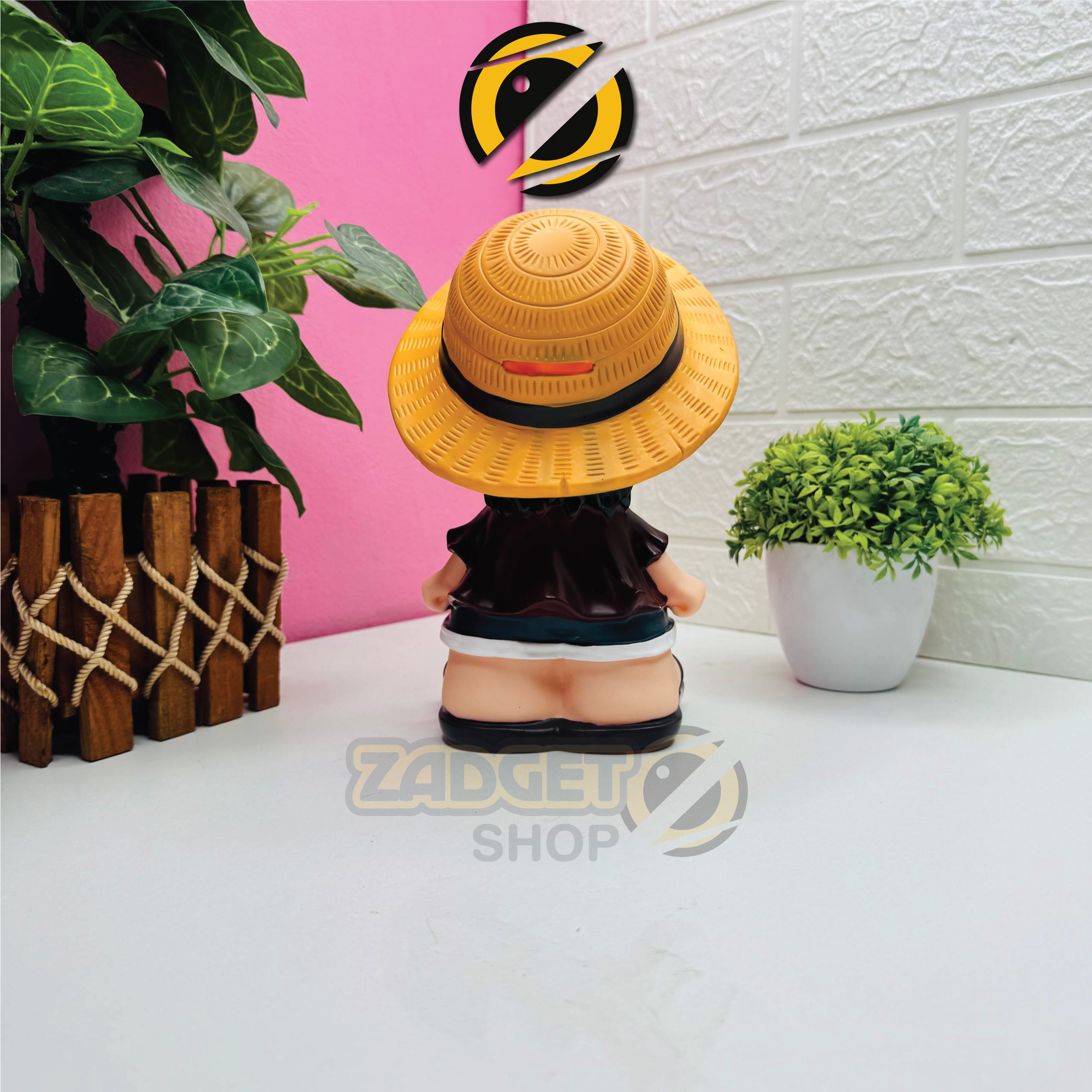 Rear view of Monkey D. Luffy Coin Bank showing detailed straw hat and character outfit